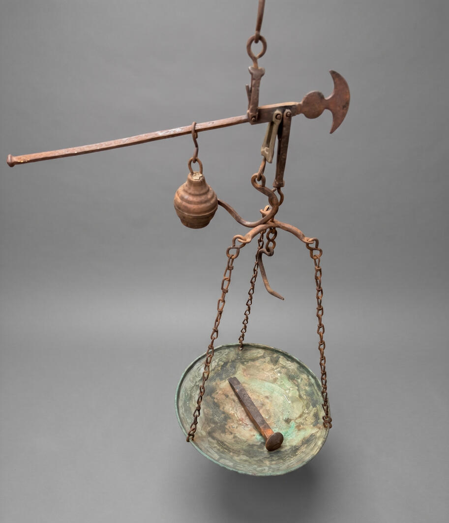 Antique 19th-century mercantile steelyard balance scale. Hand-hammered brass pan with verdigris and forged wrought iron beam. Authentic primitive merchant scale in California.