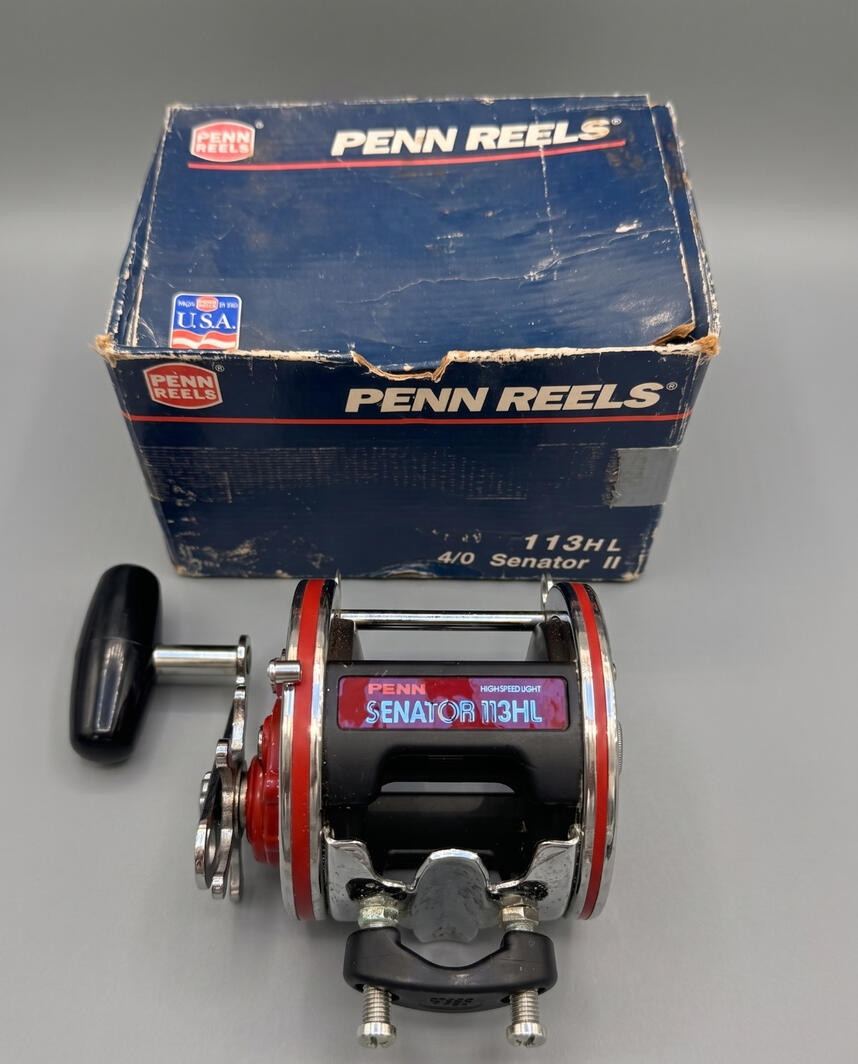 Vintage Penn Senator 113HL High Speed 4/0 saltwater fishing reel. Made in USA model with red side plates, chrome finish, and original box. Professionally serviced offshore fishing tackle in California